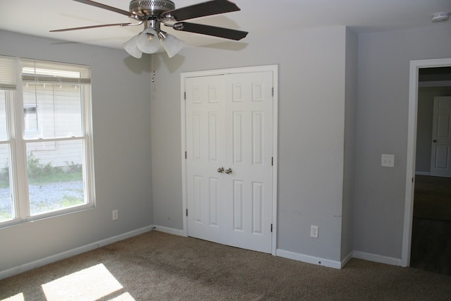 3813 Meritas Dr, Columbus, GA 31904 - unfurnished bedroom featuring multiple windows, carpet, a closet, and ceiling fan