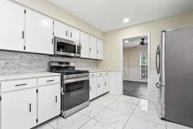 2630 Skylake Dr, Columbus, GA 31907 - kitchen with stainless steel appliances, a ceiling fan, recessed lighting, backsplash, and light marble finish flooring