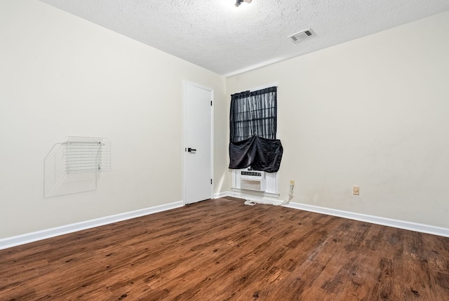 2630 Skylake Dr, Columbus, GA 31907 - empty room with wood finished floors and a textured ceiling