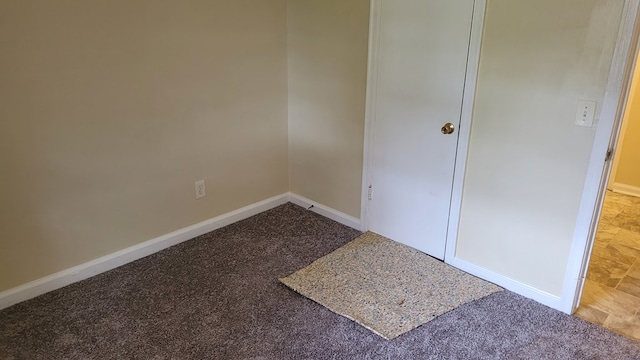 unfurnished bedroom featuring baseboards and carpet floors