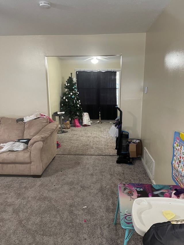 carpeted living room featuring visible vents