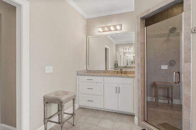 full bath featuring crown molding, a stall shower, vanity, baseboards, and tile patterned floors