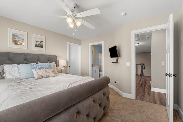 carpeted bedroom featuring ceiling fan, baseboards, and connected bathroom