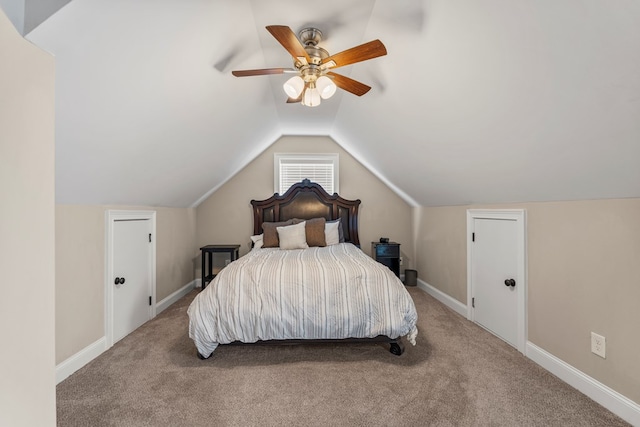 bedroom featuring baseboards, vaulted ceiling, a ceiling fan, and carpet flooring