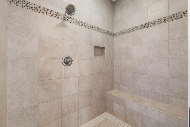 full bathroom with tiled shower