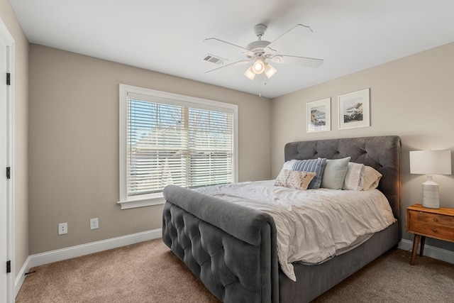 bedroom with a ceiling fan, baseboards, visible vents, and carpet flooring