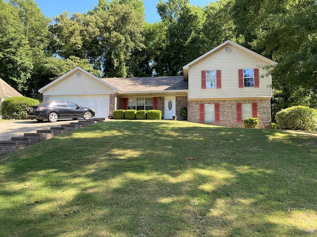 view of front of property with a front lawn and a garage