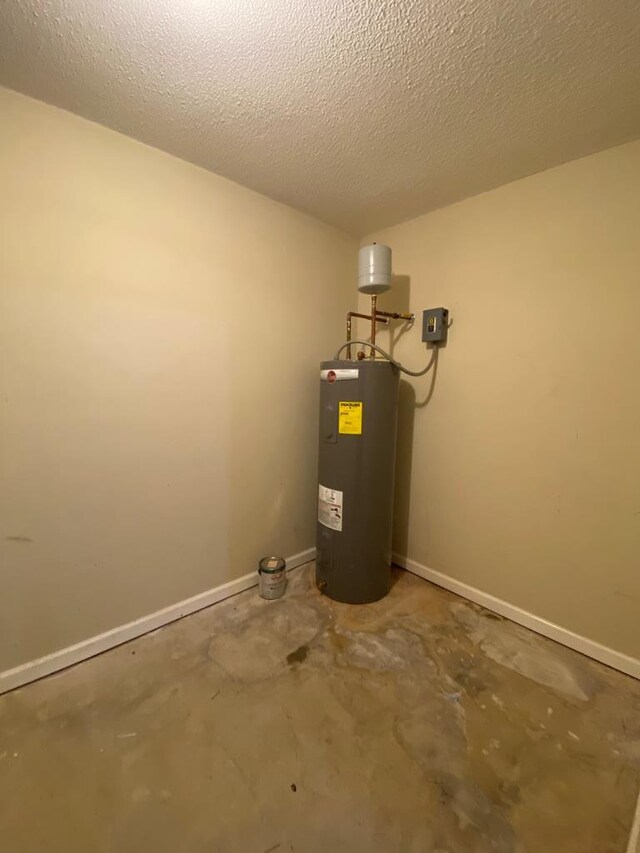 utility room featuring electric water heater