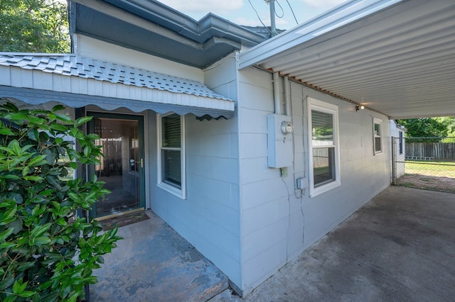 view of side of home with fence