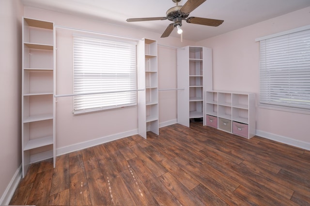 unfurnished bedroom with wood finished floors, baseboards, and a ceiling fan
