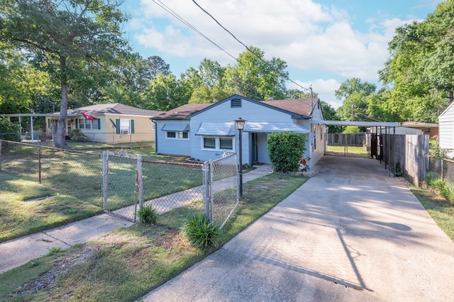 bungalow-style house featuring a carport, driveway, and a gate