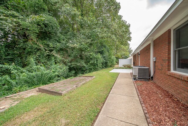 view of yard with a patio and central AC