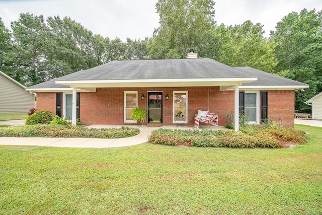 ranch-style home with a porch and a front yard