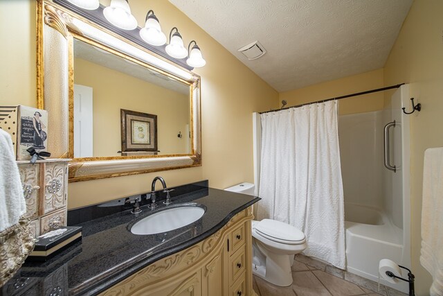 full bathroom featuring tile patterned floors, toilet, a textured ceiling, vanity, and shower / bath combination with curtain