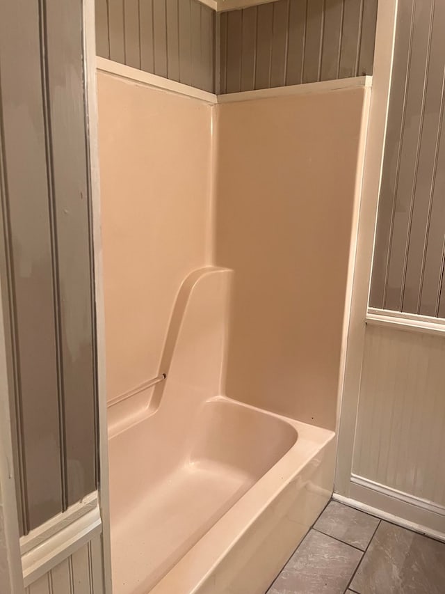 bathroom with tile patterned flooring and plus walk in shower