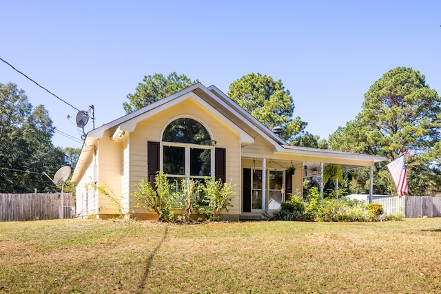 view of front of house featuring central air condition unit and a front lawn