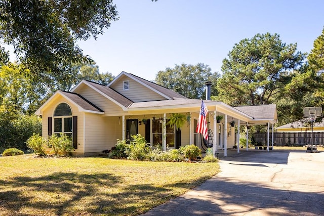 view of front facade with a front yard and a carport