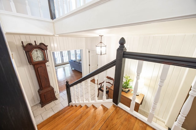 stairs with tile patterned floors