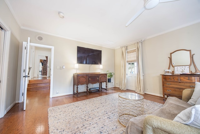 living room featuring dark hardwood / wood-style floors and ornamental molding