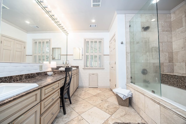 bathroom featuring bath / shower combo with glass door, tile patterned flooring, tile walls, vanity, and ornamental molding