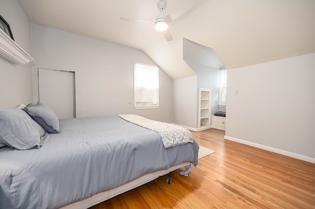 bedroom with vaulted ceiling, ceiling fan, and light hardwood / wood-style flooring