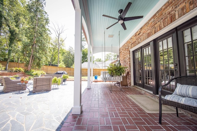 view of patio featuring ceiling fan, outdoor lounge area, and french doors