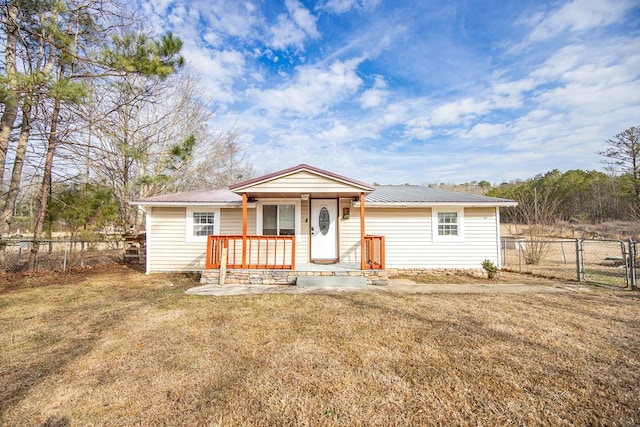 ranch-style home with a porch and a front yard