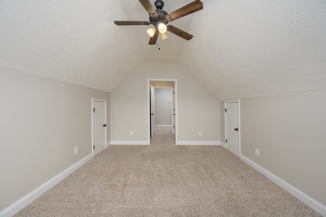 2708 Sawgrass Ln, Phenix City, AL 36867 - additional living space featuring ceiling fan, vaulted ceiling, light carpet, and baseboards