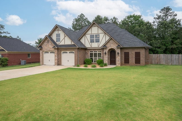 2708 Sawgrass Ln, Phenix City, AL 36867 - tudor home featuring fence, a front lawn, brick siding, central AC unit, and driveway
