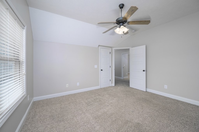 2708 Sawgrass Ln, Phenix City, AL 36867 - unfurnished bedroom featuring carpet floors, vaulted ceiling, and multiple windows