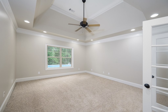 2708 Sawgrass Ln, Phenix City, AL 36867 - carpeted empty room featuring crown molding, ceiling fan, baseboards, a tray ceiling, and visible vents