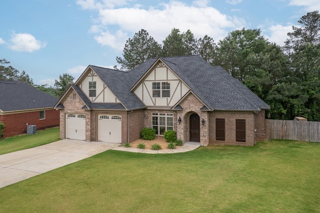 2708 Sawgrass Ln, Phenix City, AL 36867 - tudor house with stucco siding, fence, driveway, and a front lawn