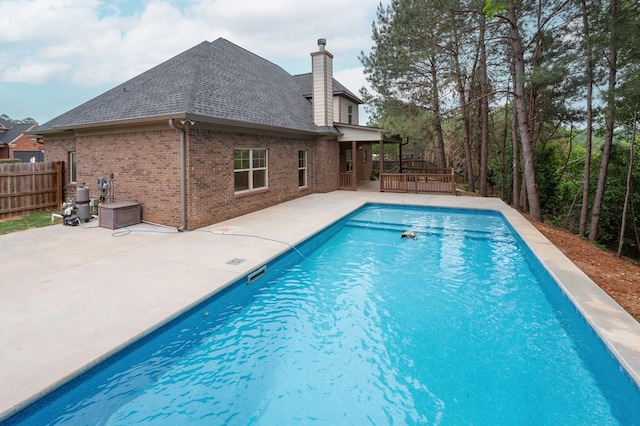 2708 Sawgrass Ln, Phenix City, AL 36867 - view of swimming pool featuring a patio, a fenced in pool, fence, and a deck