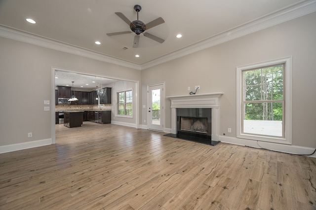 2708 Sawgrass Ln, Phenix City, AL 36867 - unfurnished living room with ceiling fan, crown molding, a fireplace, light wood-type flooring, and recessed lighting