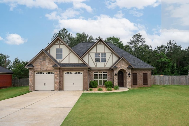 2708 Sawgrass Ln, Phenix City, AL 36867 - tudor home featuring concrete driveway, fence, a front lawn, and stucco siding