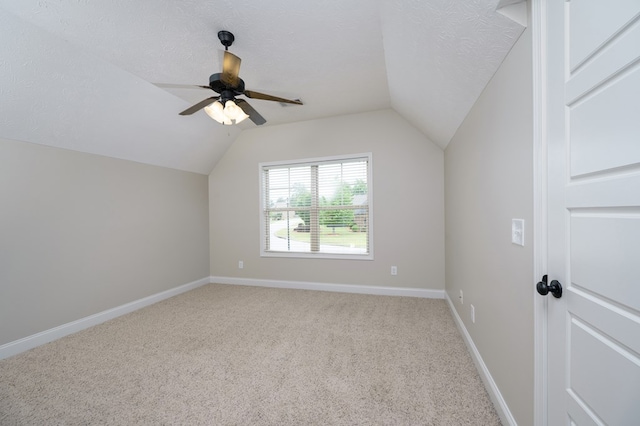 2708 Sawgrass Ln, Phenix City, AL 36867 - bonus room with a ceiling fan, a textured ceiling, baseboards, lofted ceiling, and light carpet