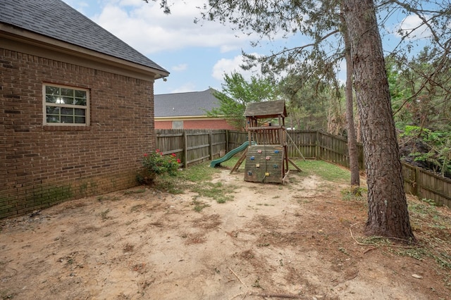 2708 Sawgrass Ln, Phenix City, AL 36867 - view of yard featuring a playground and a fenced backyard