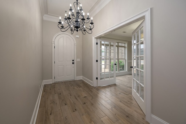 2708 Sawgrass Ln, Phenix City, AL 36867 - foyer entrance with crown molding, baseboards, a chandelier, and hardwood / wood-style flooring