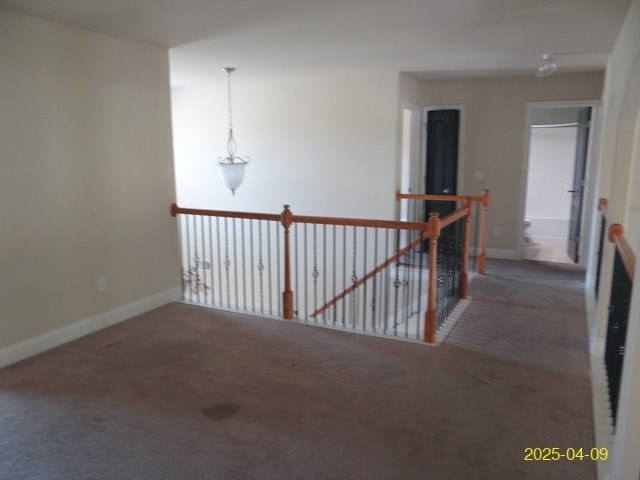 8 Rusty Dr, Phenix City, AL 36869 - hallway with baseboards, carpet floors, and an upstairs landing