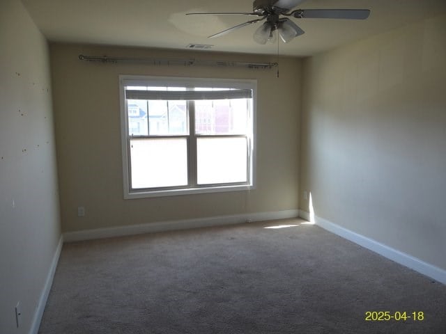 8 Rusty Dr, Phenix City, AL 36869 - carpeted spare room featuring baseboards, visible vents, and a ceiling fan