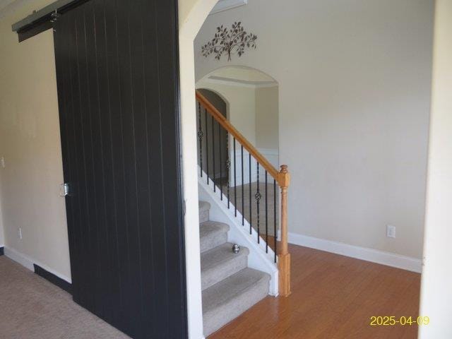 8 Rusty Dr, Phenix City, AL 36869 - staircase with baseboards, arched walkways, and wood finished floors