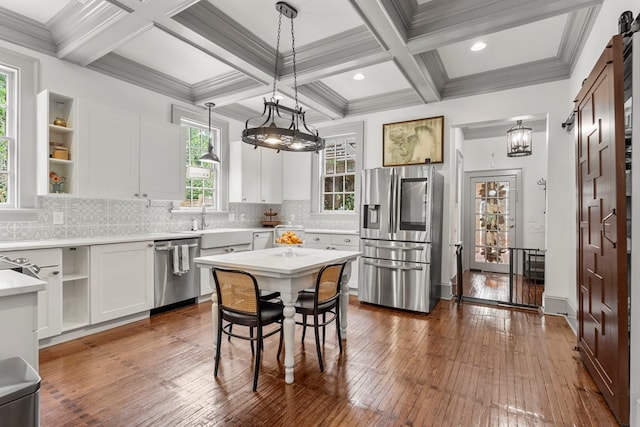 1580 Dixon Dr, Columbus, GA 31906 - kitchen with appliances with stainless steel finishes, coffered ceiling, light countertops, pendant lighting, and open shelves