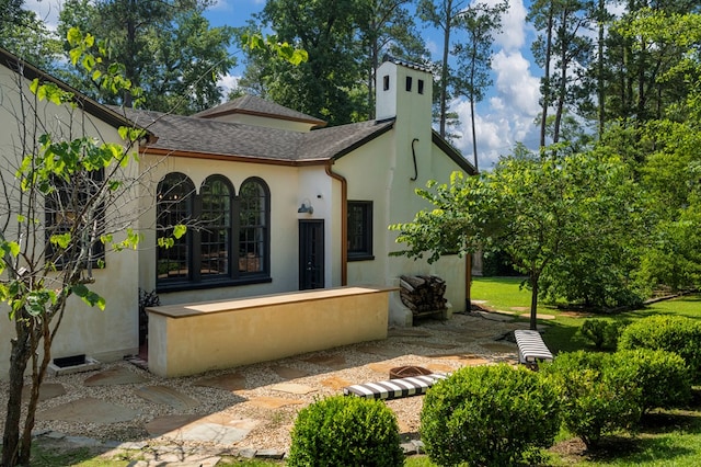 1580 Dixon Dr, Columbus, GA 31906 - back of property with stucco siding and roof with shingles