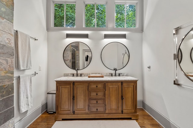1580 Dixon Dr, Columbus, GA 31906 - full bath with wood finished floors, plenty of natural light, and double vanity