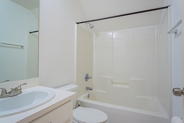 bathroom featuring toilet, vanity, and  shower combination