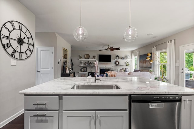 221 Abberly Ln, Ellerslie, GA 31807 - kitchen with dishwasher, a fireplace, ceiling fan, open floor plan, and light stone counters