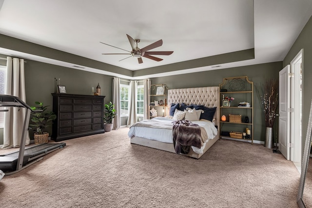 221 Abberly Ln, Ellerslie, GA 31807 - bedroom featuring carpet floors, a ceiling fan, and a raised ceiling