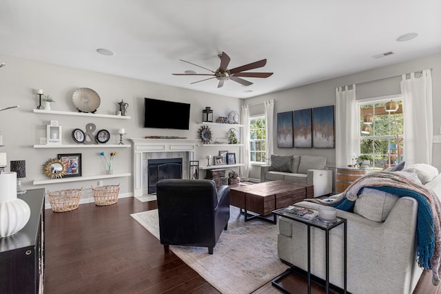 221 Abberly Ln, Ellerslie, GA 31807 - living area featuring a ceiling fan, wood finished floors, and a tiled fireplace