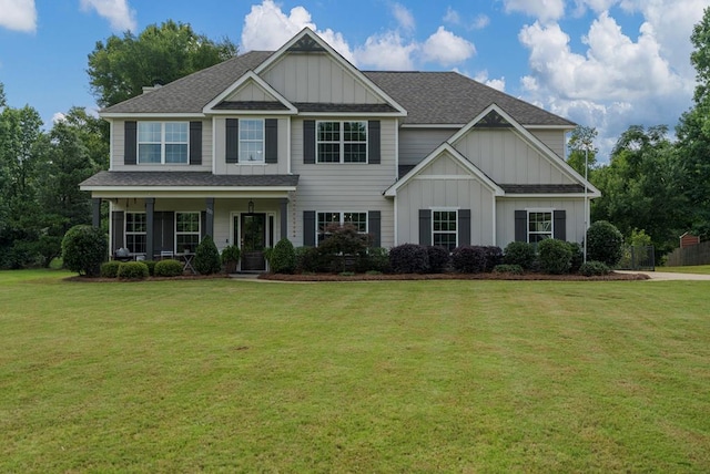 221 Abberly Ln, Ellerslie, GA 31807 - view of front of house with board and batten siding, a front lawn, and a shingled roof