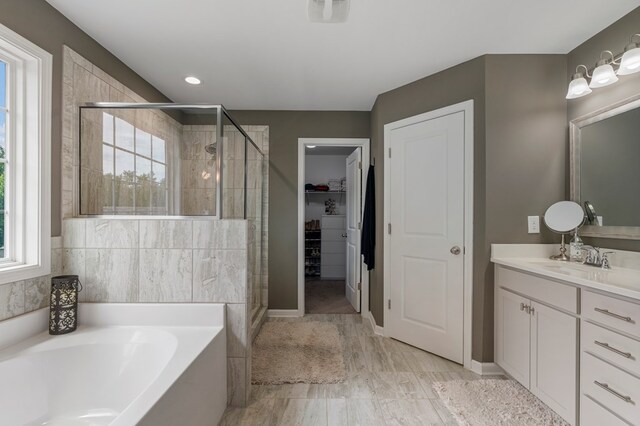 221 Abberly Ln, Ellerslie, GA 31807 - bathroom with a bath, a stall shower, and plenty of natural light